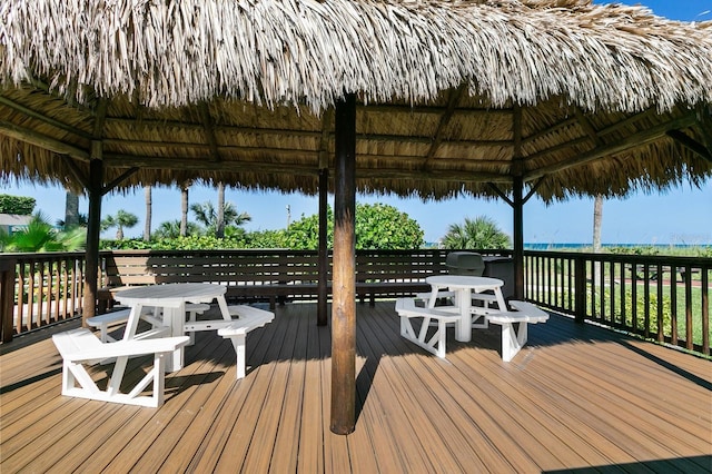 wooden terrace featuring a gazebo