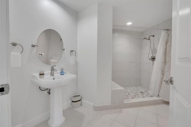 bathroom featuring walk in shower and tile patterned floors