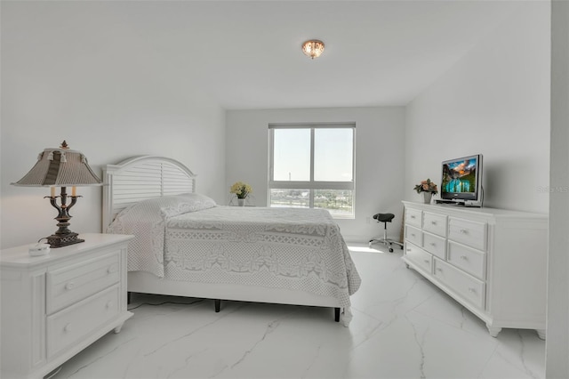 bedroom featuring marble finish floor