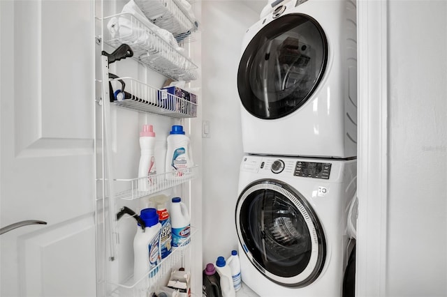 washroom with laundry area and stacked washer and clothes dryer