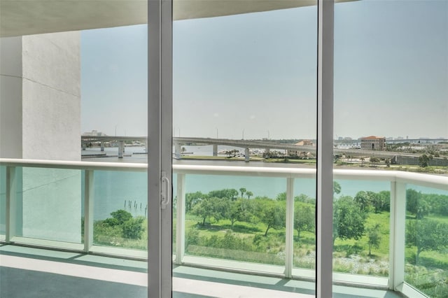 view of swimming pool featuring a water view and a city view