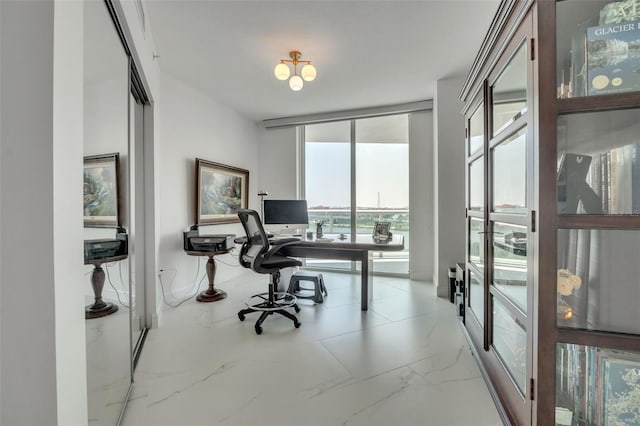 office space featuring marble finish floor and floor to ceiling windows