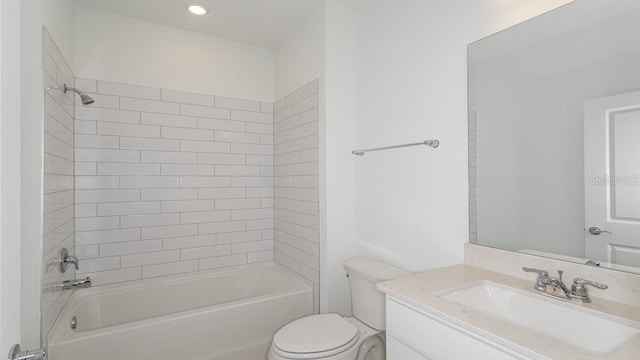 full bathroom with vanity, tiled shower / bath combo, and toilet