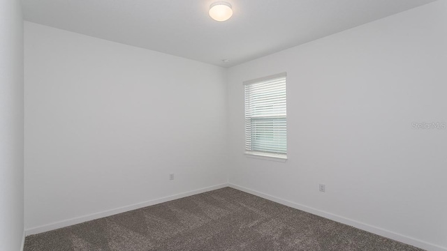 unfurnished room with carpet floors