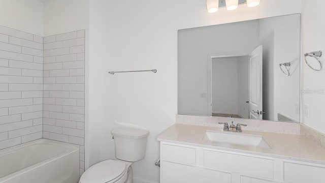 full bathroom featuring tiled shower / bath combo, vanity, and toilet