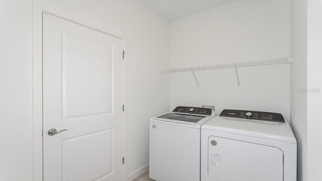 laundry area with washer and clothes dryer