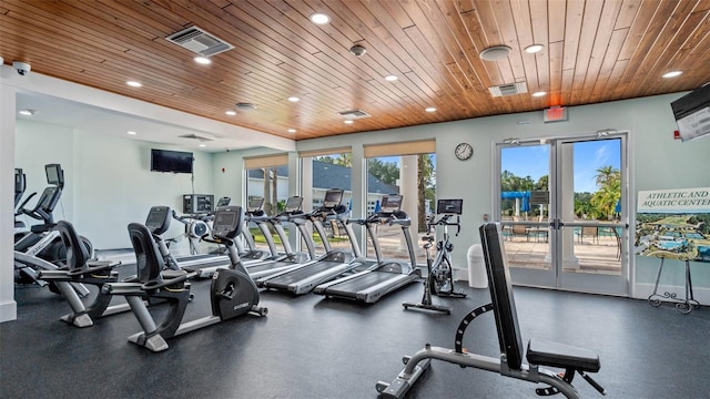 exercise room featuring french doors and wood ceiling