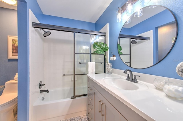 full bathroom with toilet, vanity, and combined bath / shower with glass door