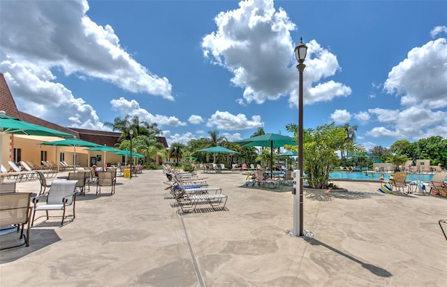 view of home's community with a patio and a swimming pool