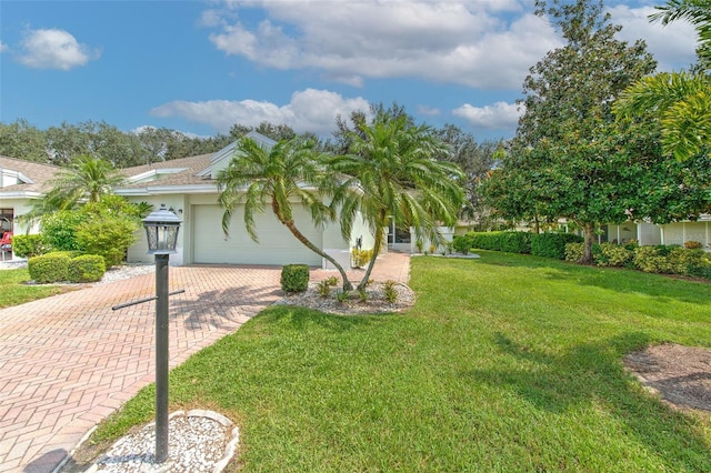 exterior space with a garage and a front lawn