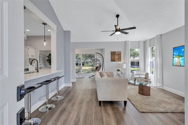 2309 Mooney Pl, Sun City Center, FL 33573 - living area with baseboards, ceiling fan, and wood finished floors