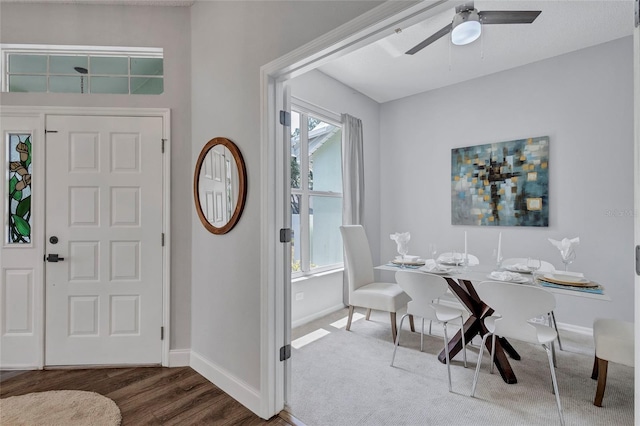 2309 Mooney Pl, Sun City Center, FL 33573 - foyer entrance featuring baseboards, ceiling fan, and dark wood-type flooring