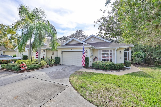 ranch-style home featuring a garage, concrete driveway, a front lawn, and stucco siding