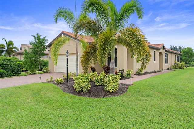 view of home's exterior with a garage and a lawn