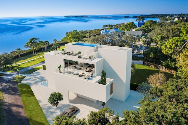 birds eye view of property with a water view