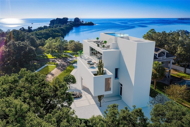 birds eye view of property featuring a water view