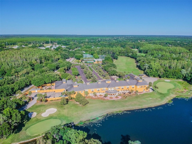 bird's eye view featuring view of golf course, a water view, and a wooded view