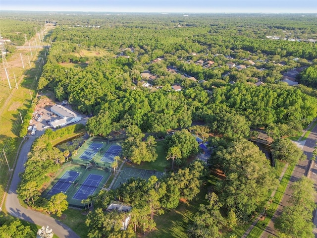 birds eye view of property featuring a wooded view