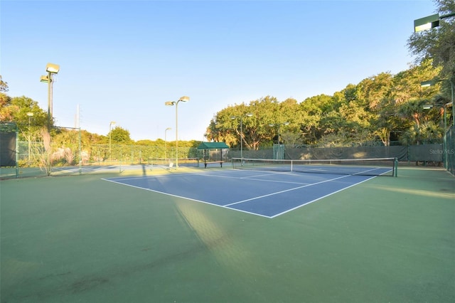 view of sport court with fence