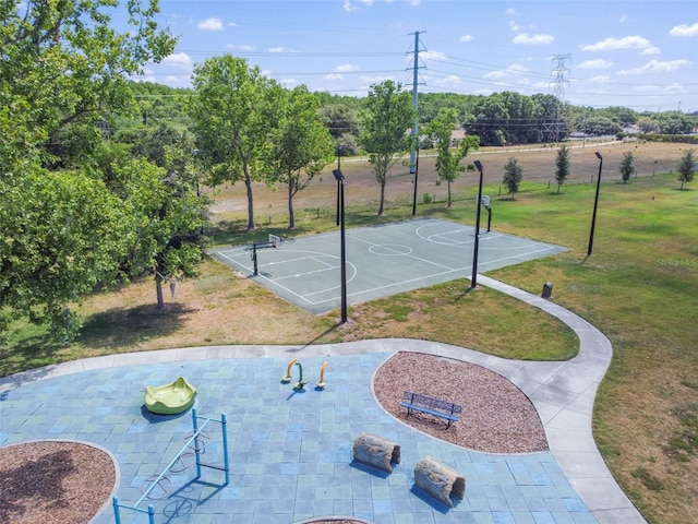 view of basketball court featuring a yard and community basketball court