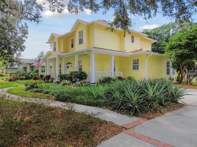 view of side of home with a porch