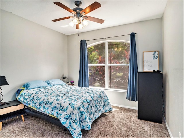 bedroom featuring ceiling fan and carpet floors