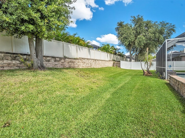 view of yard featuring glass enclosure