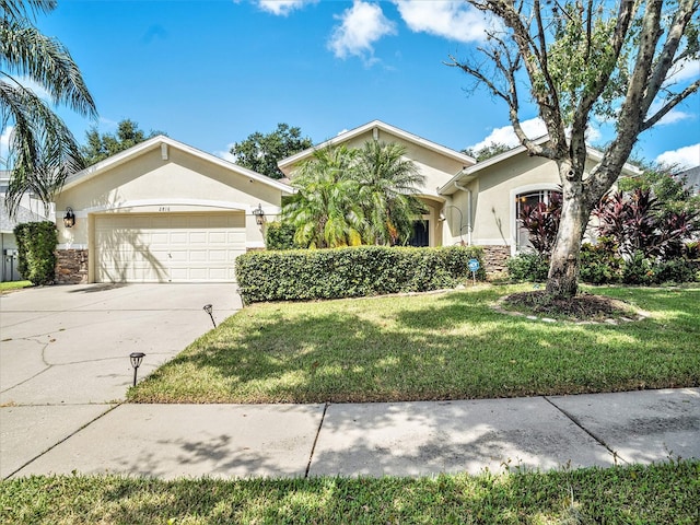 view of front of house featuring a front yard and a garage