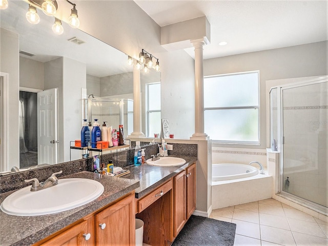 bathroom featuring tile patterned flooring, vanity, separate shower and tub, and decorative columns