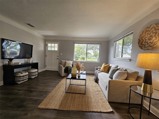 3763 Dartmouth Ave N, Saint Petersburg, FL 33713 - living room featuring baseboards and dark wood-type flooring