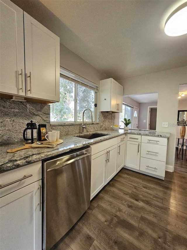 3763 Dartmouth Ave N, Saint Petersburg, FL 33713 - kitchen with a sink, dishwasher, dark wood-style floors, backsplash, and plenty of natural light