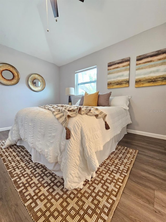 3763 Dartmouth Ave N, Saint Petersburg, FL 33713 - bedroom with wood finished floors, baseboards, lofted ceiling, and a ceiling fan