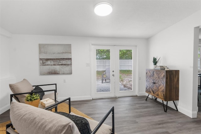 sitting room with wood-type flooring and french doors