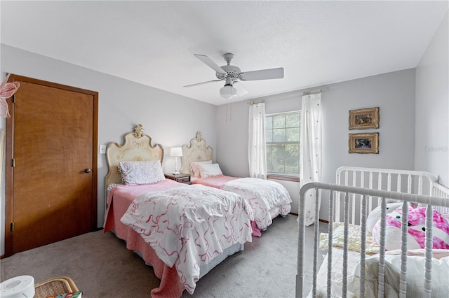 carpeted bedroom featuring ceiling fan