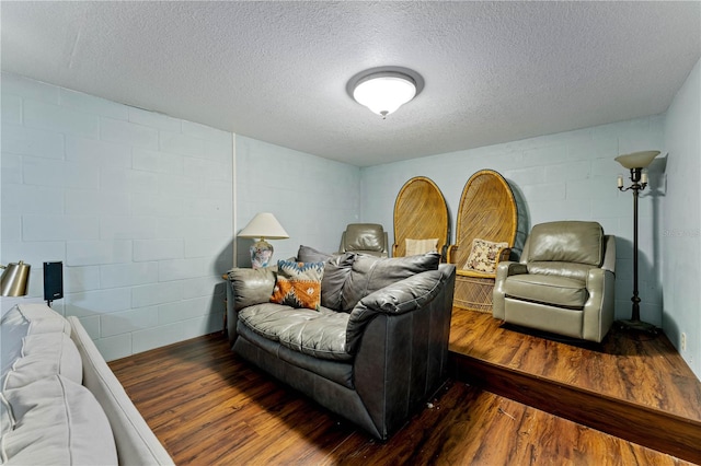 bedroom featuring hardwood / wood-style flooring and a textured ceiling