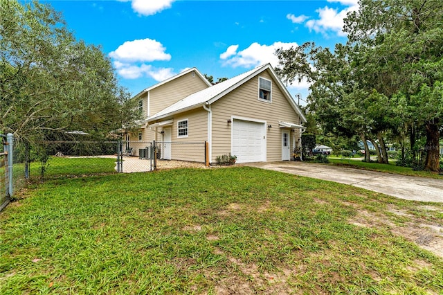 view of property exterior with a yard and a garage