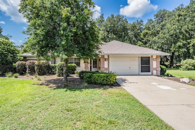 ranch-style house featuring a garage and a front lawn