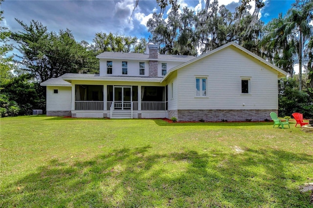 back of house with a yard, central air condition unit, and a sunroom