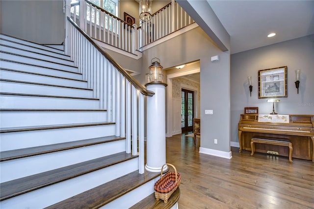 foyer featuring an inviting chandelier and hardwood / wood-style flooring