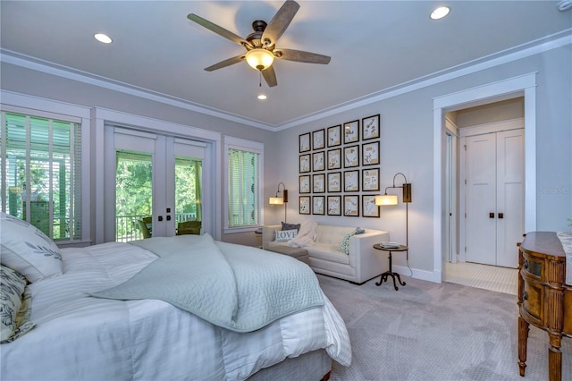 bedroom featuring access to exterior, light carpet, french doors, ornamental molding, and ceiling fan