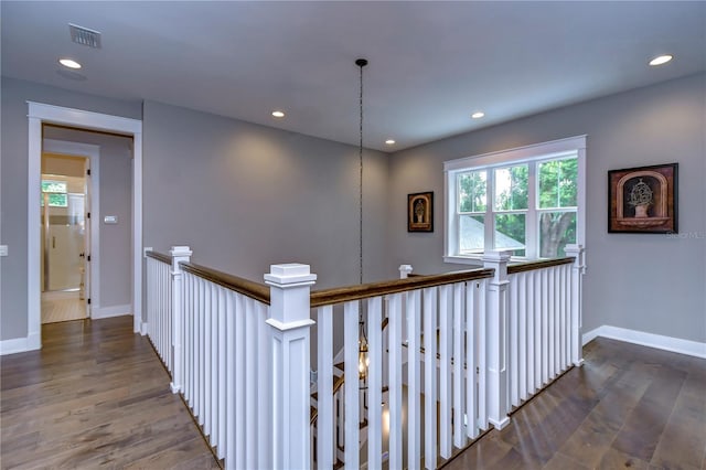 hallway featuring dark hardwood / wood-style flooring