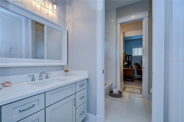 bathroom featuring tile patterned flooring and vanity