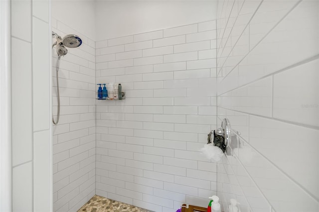 full bathroom with tiled shower