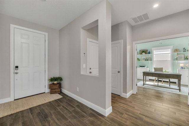 entrance foyer with dark hardwood / wood-style flooring