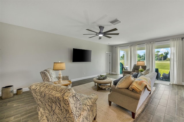 living room featuring ceiling fan and wood-type flooring