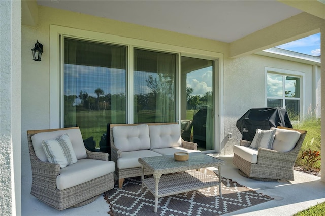 view of patio with area for grilling and an outdoor living space