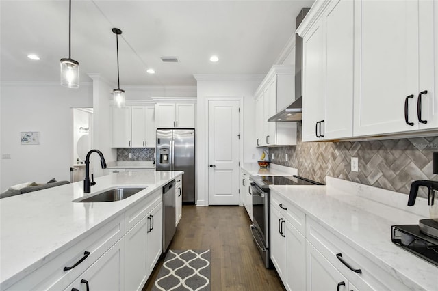 kitchen with decorative light fixtures, sink, stainless steel appliances, and white cabinets