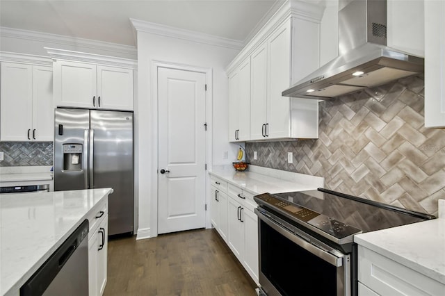 kitchen featuring wall chimney exhaust hood, stainless steel appliances, white cabinetry, and light stone counters