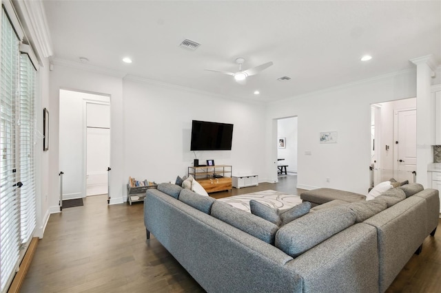 living room featuring crown molding, dark hardwood / wood-style floors, and ceiling fan