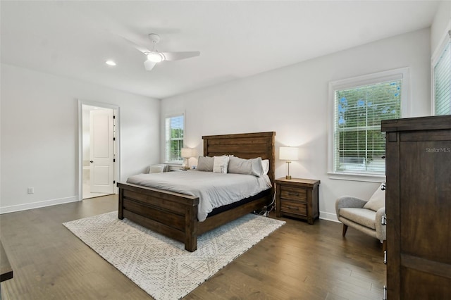 bedroom with dark hardwood / wood-style flooring and ceiling fan